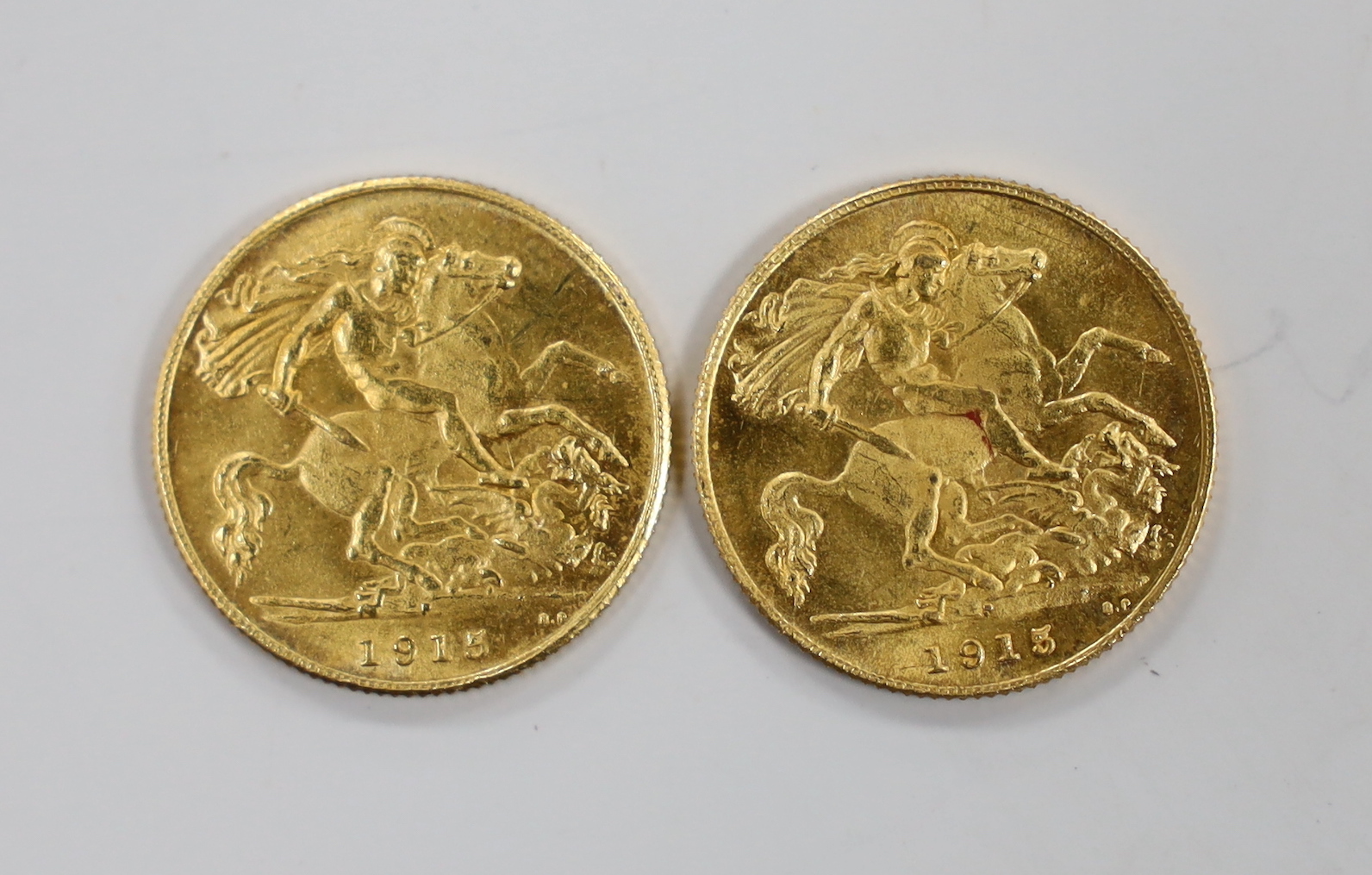 British coins, two George V gold half sovereigns, 1915P, VF